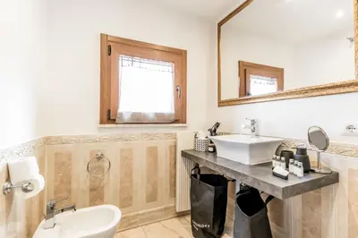 a bathroom with a sink and a mirror at My San Pietro Home, Vaticano in Rome