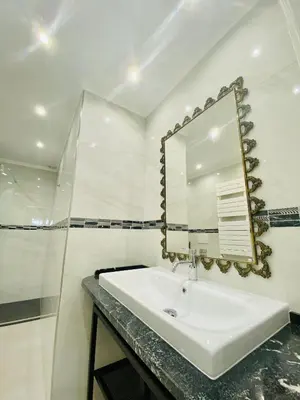 a bathroom with a sink and a mirror at Olympic Suite Roma in Rome