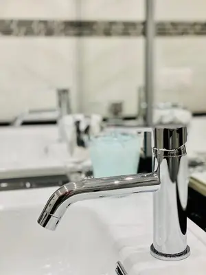 a kitchen sink with a faucet on a counter at Olympic Suite Roma in Rome