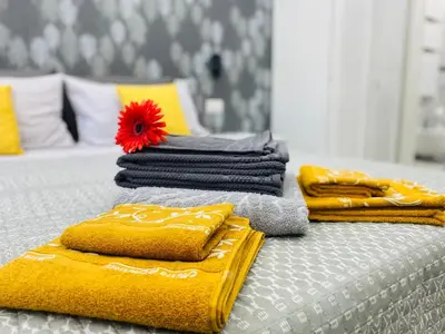 a group of towels sitting on top of a bed at Olympic Suite Roma in Rome