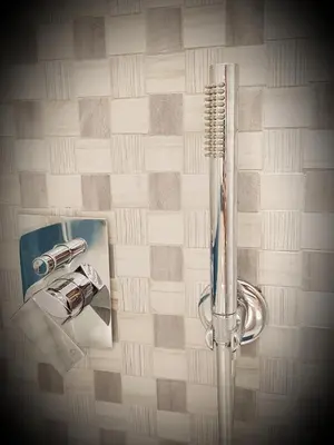 a bathroom with a shower with a toothbrush at In Rome Trastevere Rooms in Rome