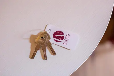 a pair of keys sitting on top of a table at Magenta Luxury Argentina in Rome