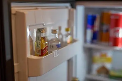 a refrigerator door with bottles of condiments in it at Magenta Luxury Argentina in Rome