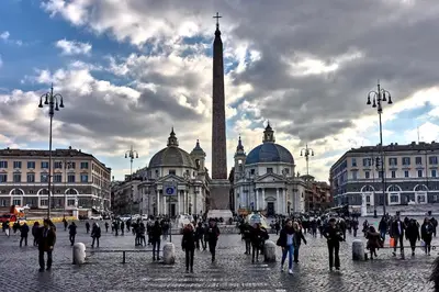 a group of people walking in front of a building at Magenta Luxury Argentina in Rome
