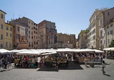 a market in a city with white umbrellas at Farnese House in Rome in Rome