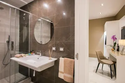 a bathroom with a sink and a shower at Residenza Venti Settembre in Rome