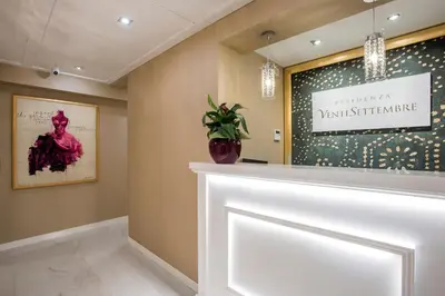 a white display case in a room with a window at Residenza Venti Settembre in Rome