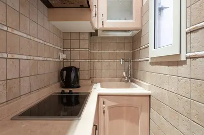 a small kitchen with a sink and a sink at Rione Di Roma Center Apartment in Rome