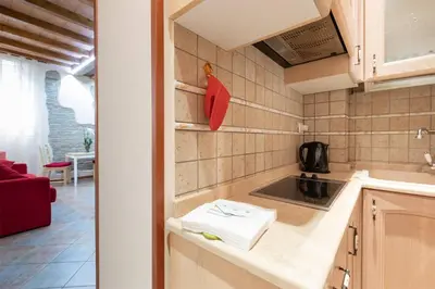 a kitchen with a sink and a counter top at Rione Di Roma Center Apartment in Rome