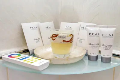 a glass table with someentalentalental products on it at Luxury Rome Guest House in Rome
