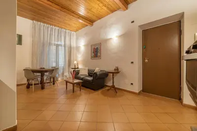 a living room with a couch and a table at GuestHost - Elegant Apartment in Rome in Rome
