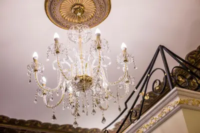 a chandelier hanging from a ceiling at Trastevere Royal Suite Trilussa in Rome
