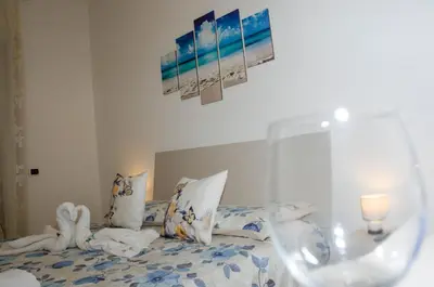 a bedroom with a bed with towels on it at Hello Rose - Appartamento intero in Rome