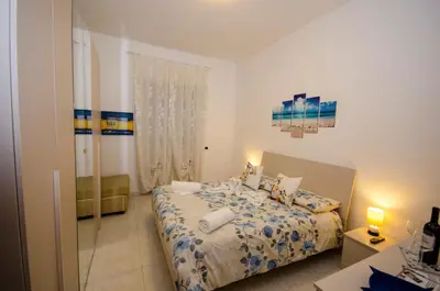 a small bedroom with a bed and a window at Hello Rose - Appartamento intero in Rome