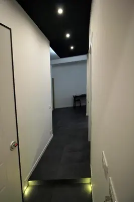 an empty hallway with a table in a room at Ale 160 in Rome