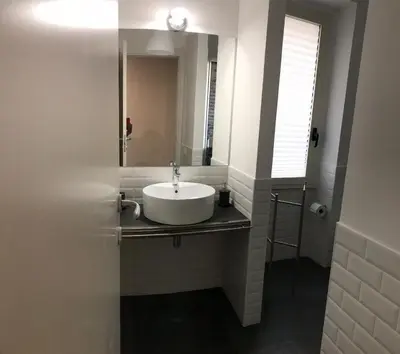 a bathroom with a sink and a mirror at Ale 160 in Rome
