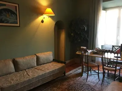 a living room with a couch and a table at Elle house Roma in Rome