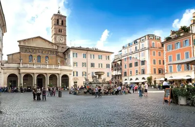 a city square with a clock tower and buildings at Guest House o Affittacamere La Civetta di Trastevere B in Rome