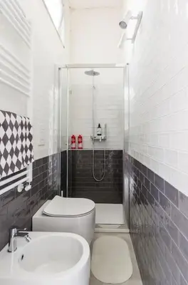 a bathroom with a toilet and a sink and a shower at Rome Apartment San Pietro - Monte del Gallo in Rome