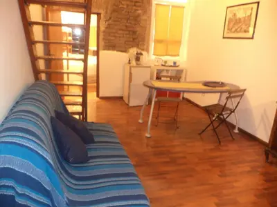 a living room with a couch and a table at Jacuzzi Quo Vadis in Rome