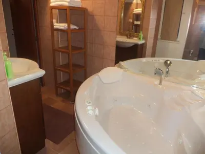 a bathroom with a tub and a sink at Jacuzzi Quo Vadis in Rome