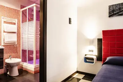 a bathroom with a toilet and a sink at Old Kitchen Vatican Suites in Rome