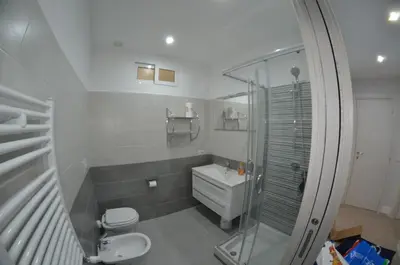 a bathroom with a shower and a toilet and a sink at Bed&bookofrome in Rome