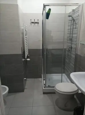 a bathroom with a shower and a toilet and a sink at Bed&bookofrome in Rome