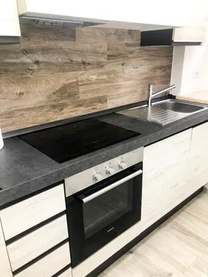 a kitchen with a sink and a stove at Delizioso Appartamento in Via di Monte Verde in Rome