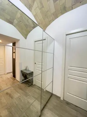 a room with a glass partition and a door at Delizioso Appartamento in Via di Monte Verde in Rome