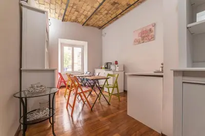 a kitchen and dining room with a table and chairs at Residenza Sistina in Rome
