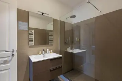 a bathroom with a sink and a shower at Residenza Palline by Hili in Rome