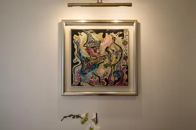 a framed painting of a woman on a wall at Your Secret Pantheon in Rome