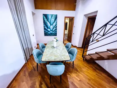 an overhead view of a dining room table and chairs at Spanish Steps Terrace Loft IREX Apartment in Rome