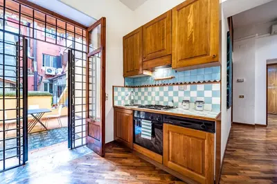 a dining room with a table and chairs at Spanish Steps Terrace Loft IREX Apartment in Rome