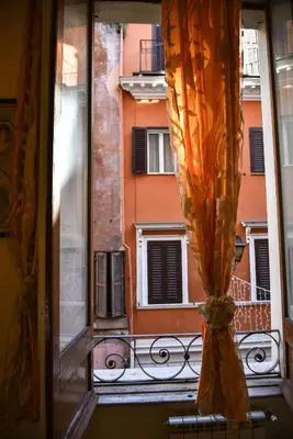 a window with a view of a building at Stylish apartment in central Rome 