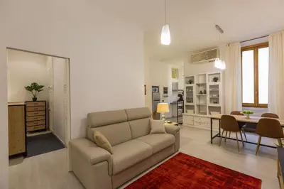 a living room with a couch and a table at Lovely New home, Trastevere! in Rome