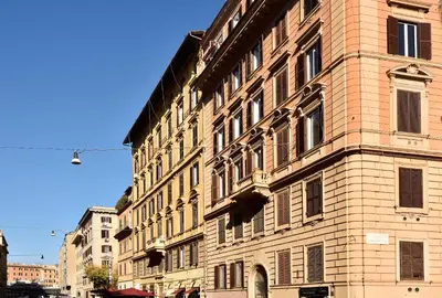 a large brick building on a city street at Velantia Vaticano - Guesthouse in Rome