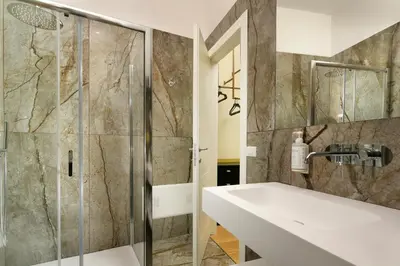 a bathroom with a sink and a shower at Velantia Vaticano - Guesthouse in Rome