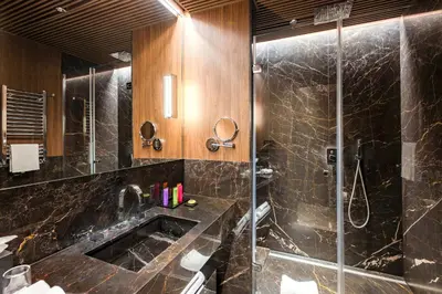 a bathroom with a sink and a shower at The First Dolce - Preferred Hotels & Resorts in Rome