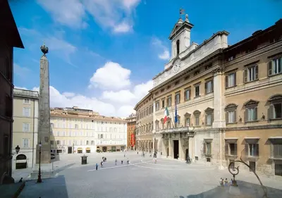 a city square with a clock tower and buildings at Amazing Trevi Fountain in Rome