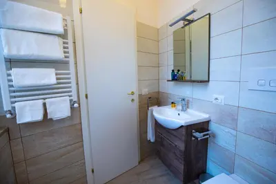 a bathroom with a sink and a mirror at Amazing Trevi Fountain in Rome