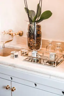 a shelf with a vase and candles on a counter at Teichnersuite in Rome