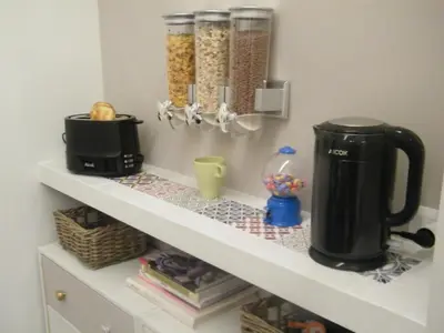 a coffee maker on a shelf in a kitchen at Pisetzky-Spadaro Apartments - Vegezio Roma in Rome