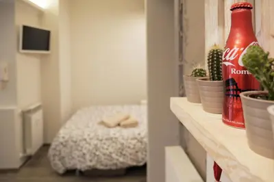 a room with a coca cola bottle on a counter at Pisetzky-Spadaro Apartments - Vegezio Roma in Rome