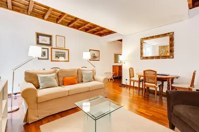 a living room with a couch and a table at Diana-Spanish Steps House in Rome