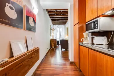 a kitchen with a counter top and a microwave at Diana-Spanish Steps House in Rome
