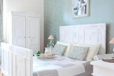 a bedroom with a white bed with pillows at Bed and Breakfast 30 in Rome