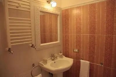 a bathroom with a sink and a mirror at Bed and Breakfast 30 in Rome