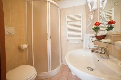 a bathroom with a shower and a toilet and a sink at Nights In Rome in Rome